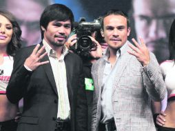 Aclarando dudas. Manny Pacquiao y Juan Manuel Márquez confirman que será el cuarto duelo entre ellos. REUTERS  /