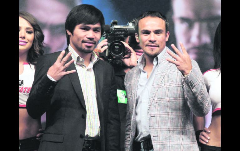 Aclarando dudas. Manny Pacquiao y Juan Manuel Márquez confirman que será el cuarto duelo entre ellos. REUTERS  /