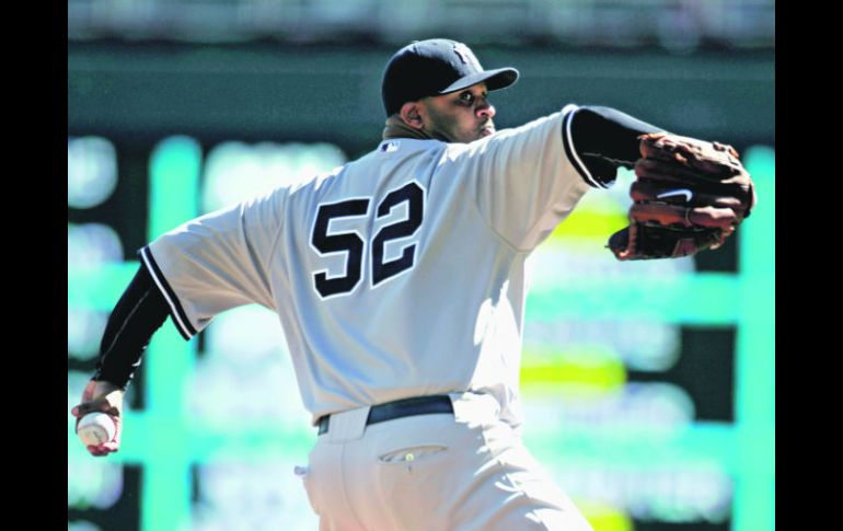 Intratable. CC Sabathia realiza un lanzamiento, durante el partido en el Target Field de Minneapolis. AFP  /