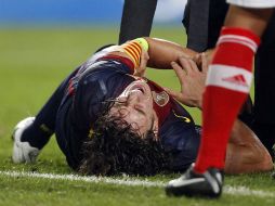 Carles Puyol sufre una nueva lesión en el partido de Champions ante el Benfica. REUTERS  /