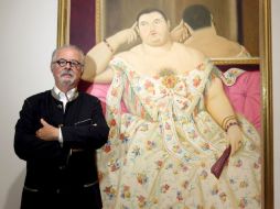 El pintor y escultor colombiano Fernando Botero, posa ante su pintura ''Madame Moitessier''. EFE  /