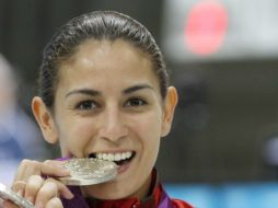 En rueda de prensa, la medallista olímpica confesó que continuará con los clavados porque aún tiene metas por cumplir . ARCHIVO  /