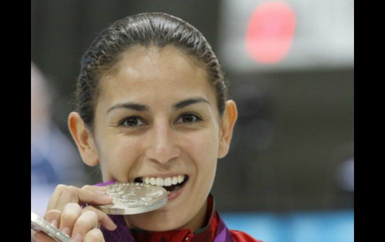 En rueda de prensa, la medallista olímpica confesó que continuará con los clavados porque aún tiene metas por cumplir . ARCHIVO  /