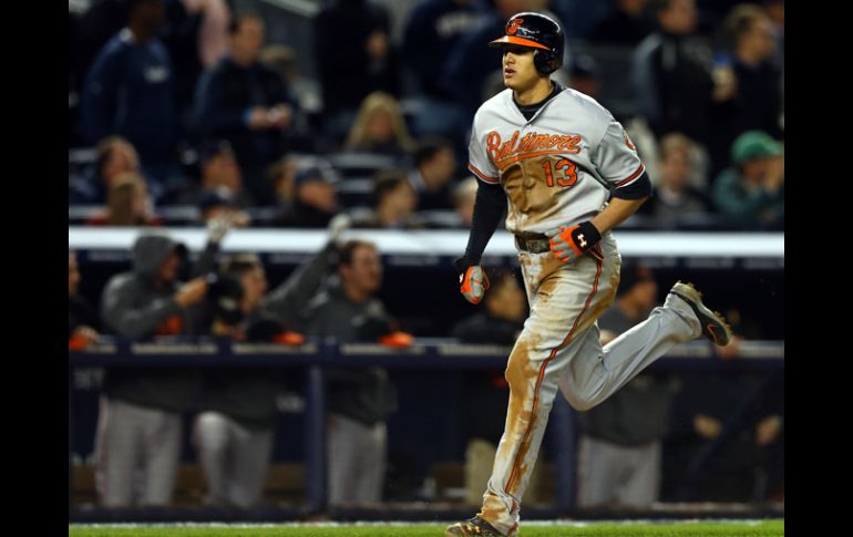 Manny Machado de los Orioles de Baltimore anoto la carrera de la victoria en el cuarto juego de la serie ante Nueva York. AFP  /