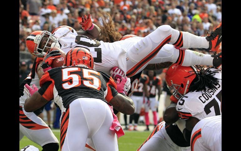 Acción del partido entre Cleveland y Cincinnati que termina con victoria para los Cafés. AP  /