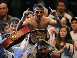 El campeón Omar Narváez derrotó en el undécimo asalto al mexicano Johnny García y retuvo su título. AFP  /