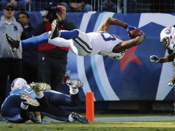 Vick Ballard dio un salto desde la yarda 4 buscando anotar para ganar el partido. AP  /