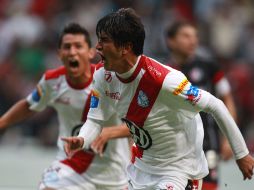 Aldo Polo, del Puebla, celebra el gol con el que La Franja empató con Atlas. MEXSPORT  /