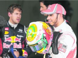 Listos. Lewis Hamilton saldrá primero; Sebastian Vettel irá por el desafío. AP  /