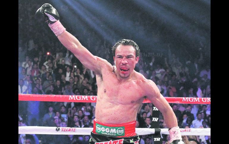 Letal. Juan Manuel Márquez celebra, tras noquear a Manny Pacquiao. REUTERS  /