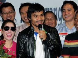 Manny Pacquiao (c), en una ceremonia de bienvenida en su honor en Manila (Filipinas). AFP  /