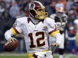 Kirk Cousins lanzó para 329 yardas y dos touchdowns. AP  /