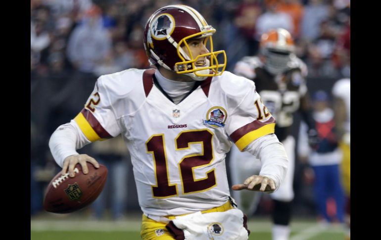 Kirk Cousins lanzó para 329 yardas y dos touchdowns. AP  /