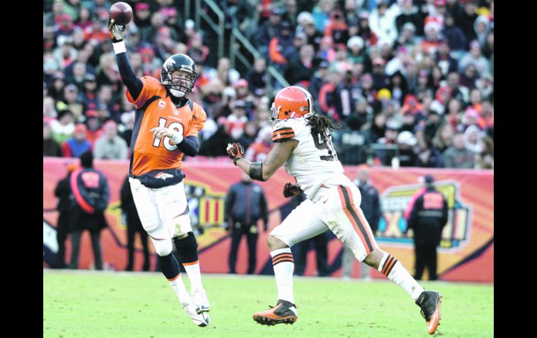 COMO SI NADA. Peyton Manning volvió a jugar luego de varias cirugías en el cuello. AP  /