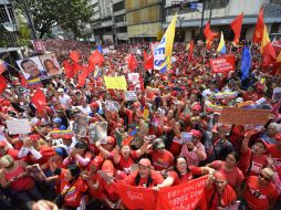 Muchos llevaban una banda presidencial de papel con los colores de la bandera venezolana. AFP /