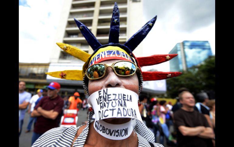 Un opositor de Chávez protesta en contra de la reelección del mandatario. AFP /