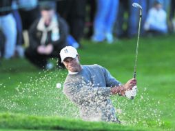 Como en los buenos tiempos. Woods está al frente con un total de 202 golpes, tras 54 hoyos. AP /