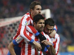 Los jugadores del Atlético de Madrid celebran uno de los goles ante el Sevilla. EFE /