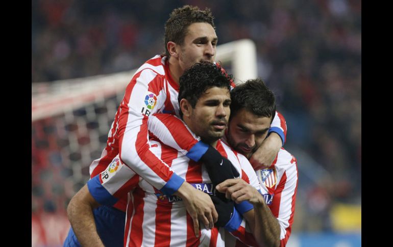 Los jugadores del Atlético de Madrid celebran uno de los goles ante el Sevilla. EFE /