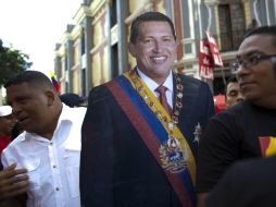 Seguidores de Hugo Chávez confían en su recuperación y le expresan su apoyo en las calles. AP /