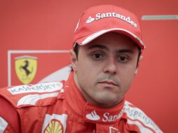 El brasileño se siente encantado de poder manejar el F138, de Ferrari. EFE /