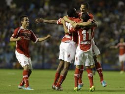 Los Diablos Rojos se repusieron de un penal fallado para terminar ganando el partido. AFP /