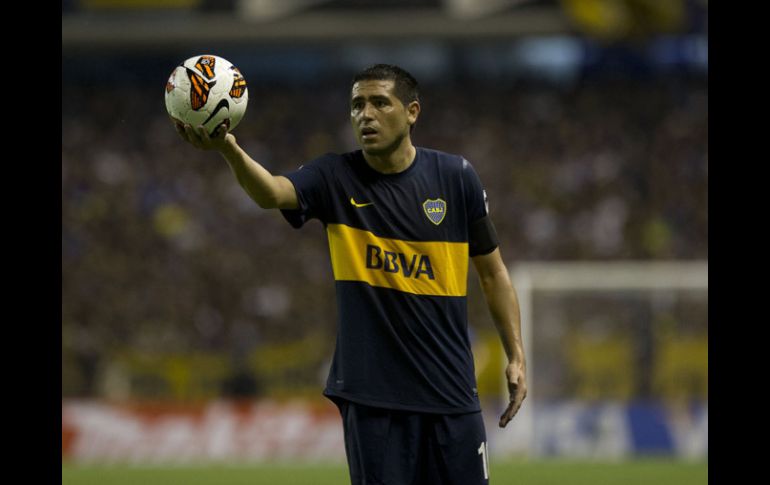 Juan Román Riquelme no ha podido meter de lleno a Boca Juniors en la pelea en los torneo que disputan. AP /