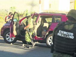 Intensa movilización. Tras el asesinato del secretario de Turismo, elementos del Ejército Mexicano llegaron a la zona de los hechos. EL INFORMADOR /