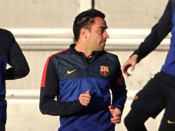 Xavi junto a Busquets e Iniesta serían la tripleta encargada del centro del campo culé. EFE /