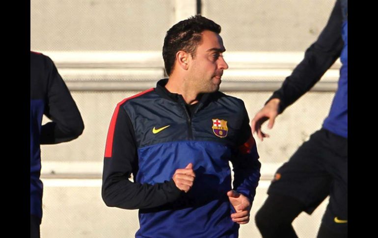 Xavi junto a Busquets e Iniesta serían la tripleta encargada del centro del campo culé. EFE /