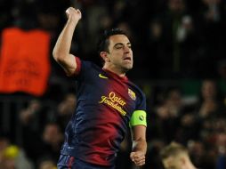 Xavi jugó los 90 minutos en la goleada al AC Milán. AFP /