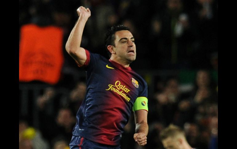 Xavi jugó los 90 minutos en la goleada al AC Milán. AFP /