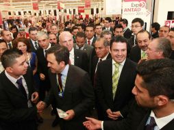 El gobernador Aristóteles Sandoval y el secretario de Economía, Ildefonso Guajardo Villarreal (c) encabezaron la inauguración del Foro.  /