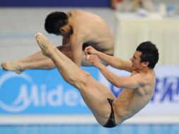 Yahel Castillo y Daniel Islas en la competencia en el Cubo de Agua. XINHUA /