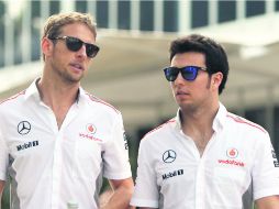 Tranquilos. Jenson Button y Sergio Pérez se mantienen a la expectativa en el circuito de Sepang.  /