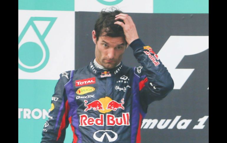 El rostro de Webber durante la premiación en Malasia reflejaba molestia y decepción. EFE /