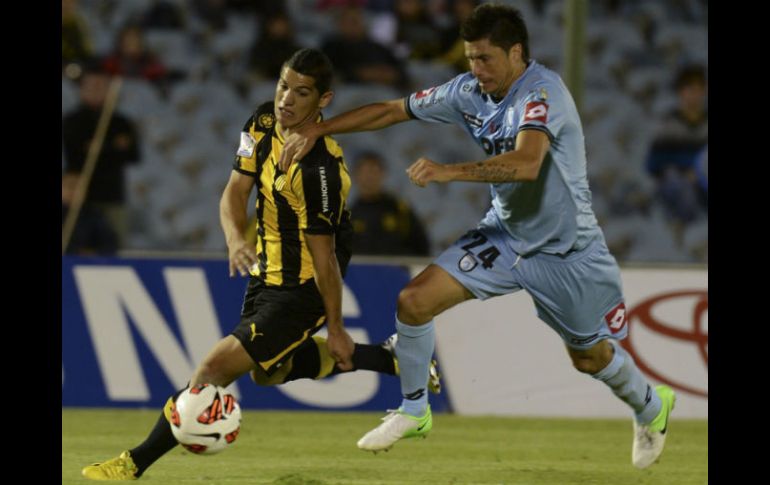 El encuentro contra Iquique se caracteriza por las imprecisiones permanentes de los futbolistas de Peñarol. AFP /