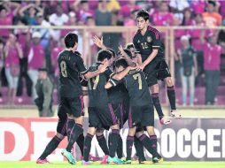 Festejo. Los jugadores mexicanos festejan el triunfo sobre los panameños. MEXSPORT /