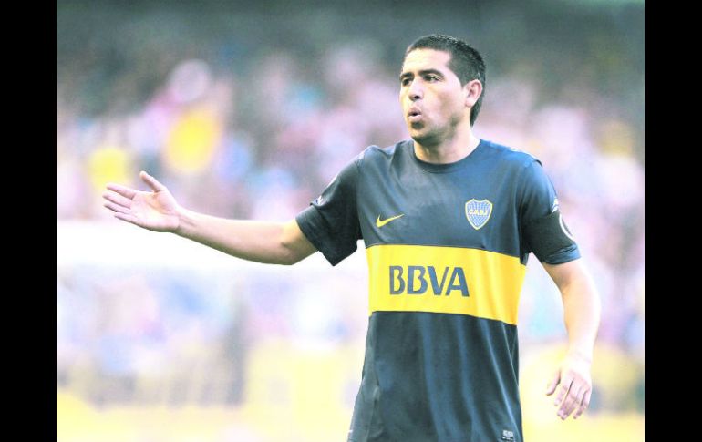 El veterano Juan Román Riquelme no puede ''echar a andar'' la maquinaria del Boca. AFP /