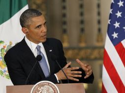 Barack Obama reafirmó su compromiso por una reforma migratoria a la vez que defendió su política de deportaciones récord. ARCHIVO /