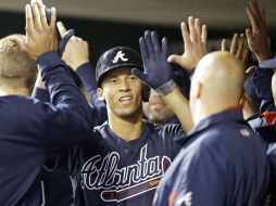 Andrelton Simmons conecta dos jonrones y empuja cuatro carreras. AP /