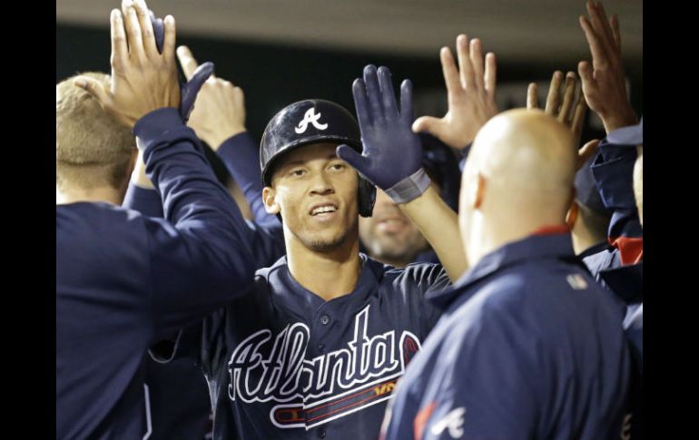 Andrelton Simmons conecta dos jonrones y empuja cuatro carreras. AP /