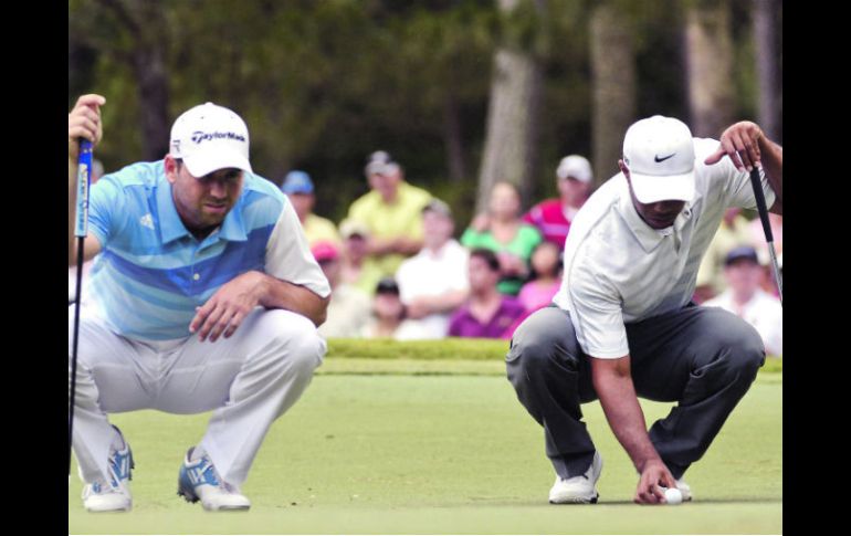 Tensa relación. Sergio García y Tiger Woods hablaron poco tras el incidente en el hoyo dos. EFE /