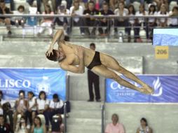 Iván García es superado por el chino Bo Qui, quien le arrebata la medalla de oro con ejecuciones casi perfectas.  /