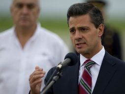 Peña Nieto da un mensaje a su llegada al Aeropuerto Internacional Alfonso Bonilla Aragón. AFP /