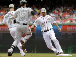 Los Orioles de Baltimore derrotan hoy a los Nacionales de Washington en partido de interligas. AP /