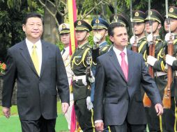 Primer acercamiento. Xi Jinping y Enrique Peña Nieto durante su encuentro del 6 de abril en China. EFE /