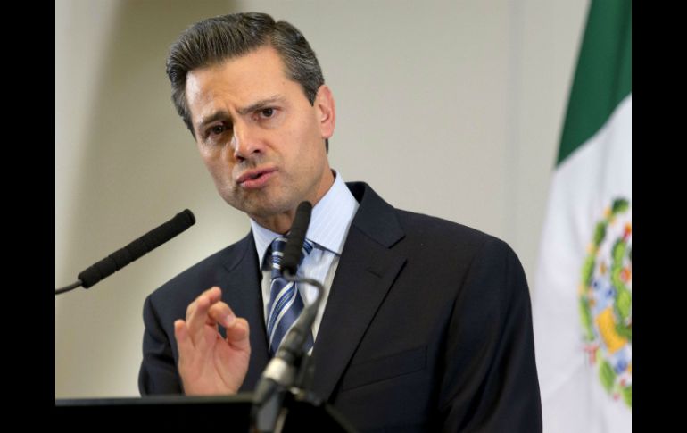 Enrique Peña Nieto anuncia en la cumbre del G-8 que el Pacto explora la inversión privada en Pemex. AFP /