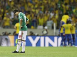 Giovani dos Santos y los jugadores mexicanos negaron la supuesta salida a un 'table' en Río de Janeiro. AP /