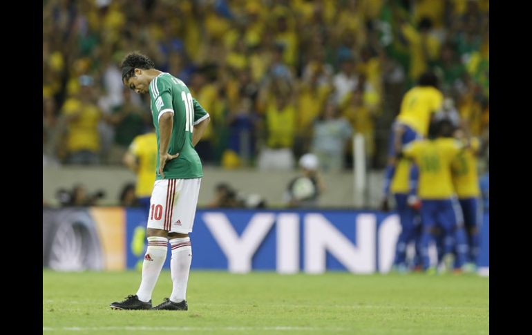 Giovani dos Santos y los jugadores mexicanos negaron la supuesta salida a un 'table' en Río de Janeiro. AP /